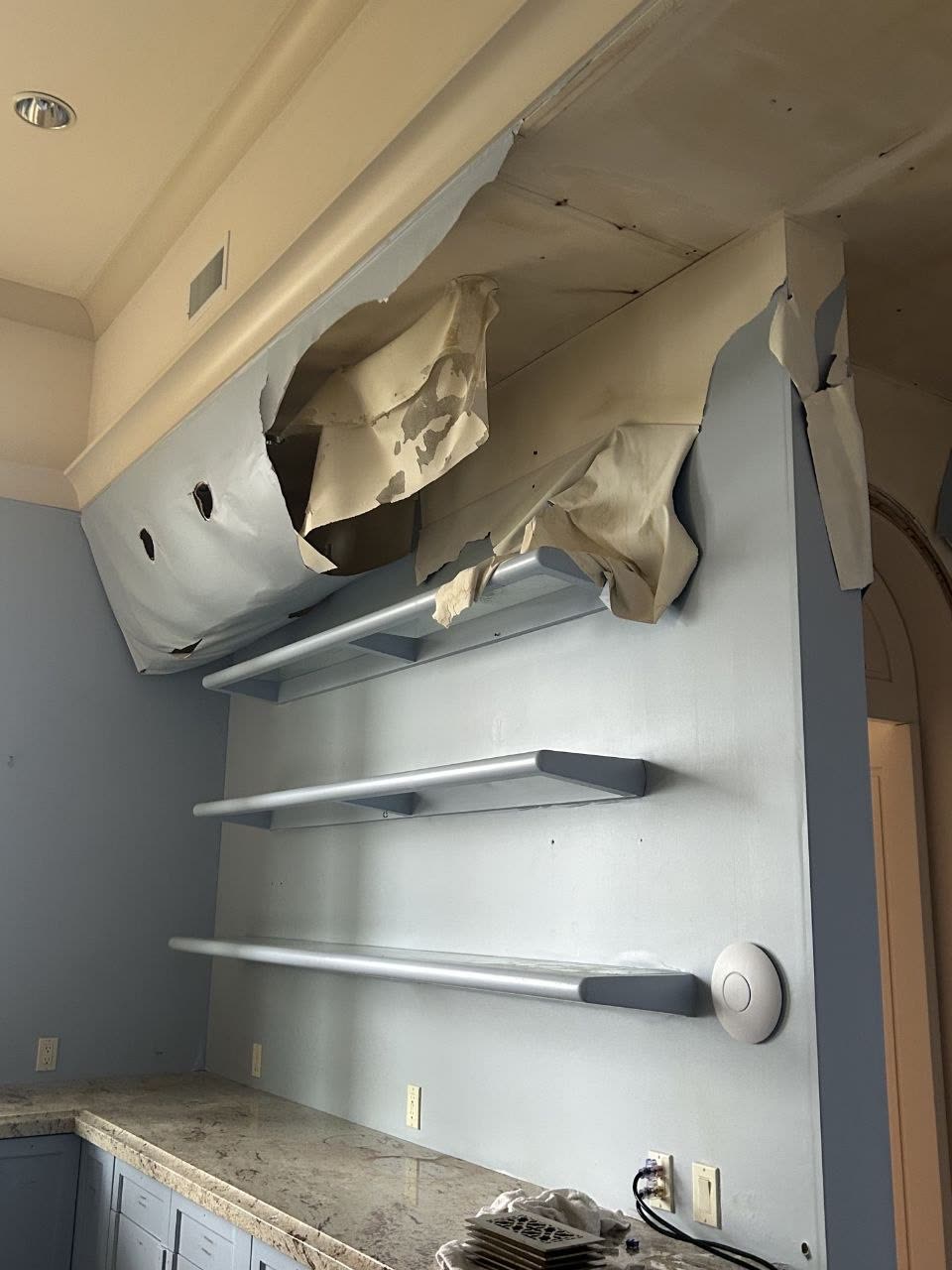 Interior cabinetry and wall damage at a client property