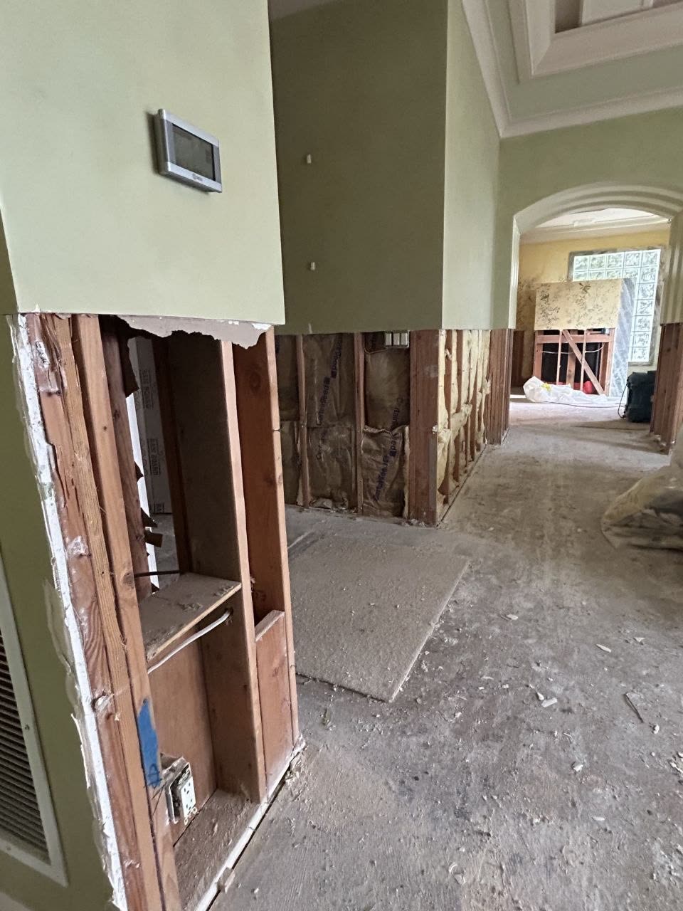 Interior framing and wall damage at a client property